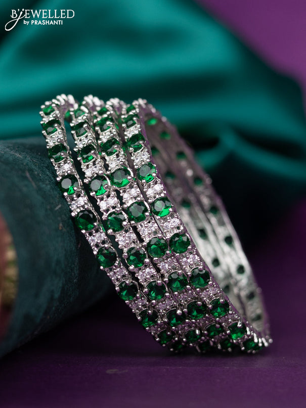 zircon bangle with emerald and cz stones