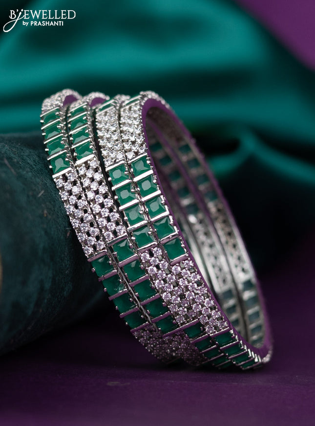 zircon bangle with emerald green and cz stones