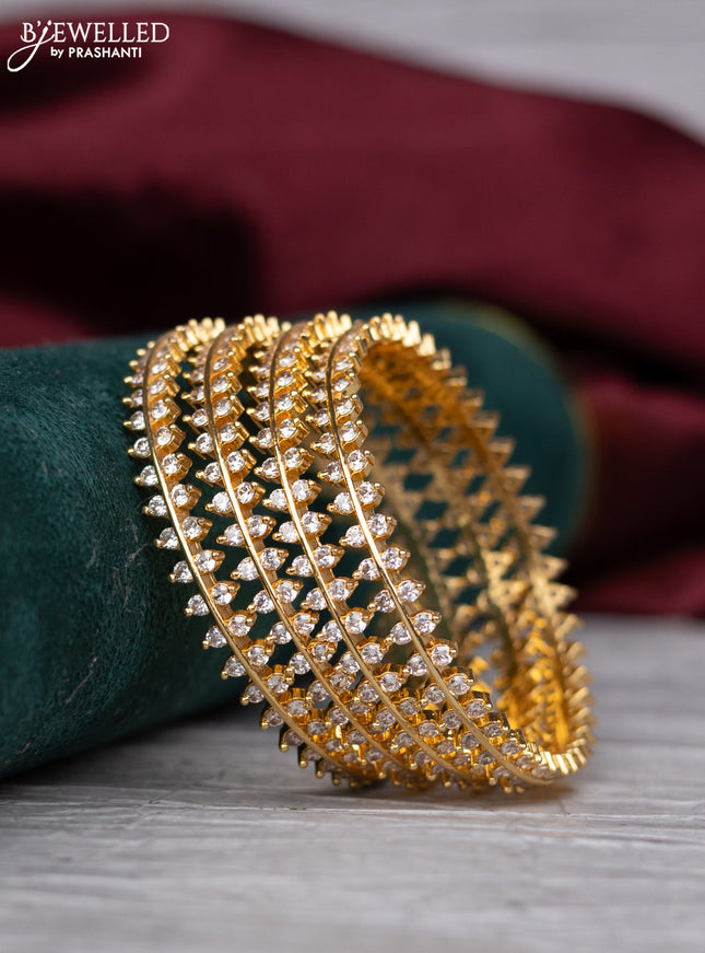 zircon bangle with gold finish and cz stones