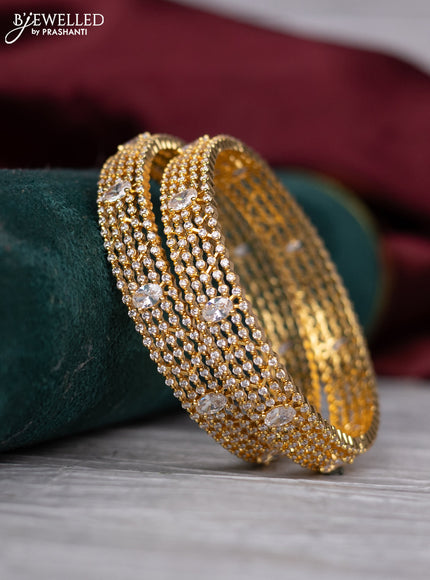 zircon bangle with gold finish and  cz stones