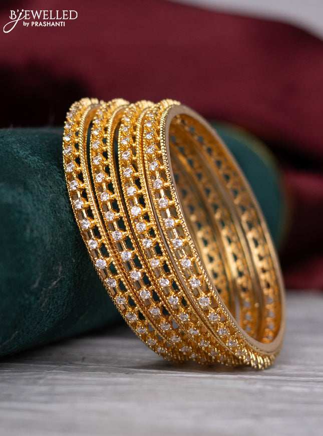 zircon bangle with gold finish and  cz stones