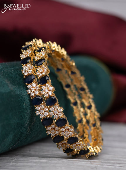 zircon bangle with gold finish sapphire and  cz stones