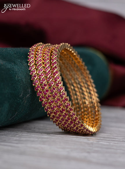 zircon bangle with ruby stones gold finish