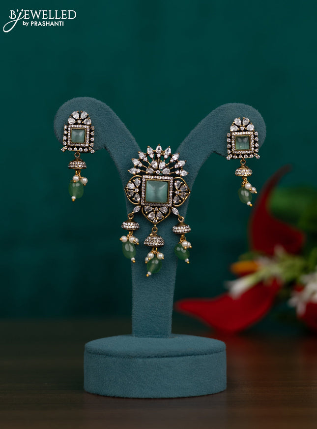 Pendant set with mint green & cz stones and green beads hangings in victorian finish