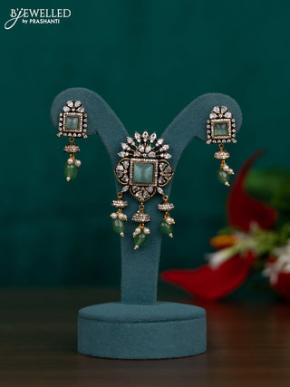Pendant set with mint green & cz stones and green beads hangings in victorian finish