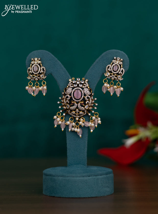Pendant set with peacock design with baby pink & cz stones and beads hangings in victorian finish