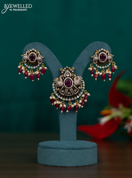 Pendant set with peacock design with ruby & cz stones and beads hangings in victorian finish