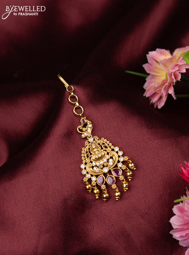 Antique maang tikka lakshmi design with pink kemp & cz stones and golden beads hangings