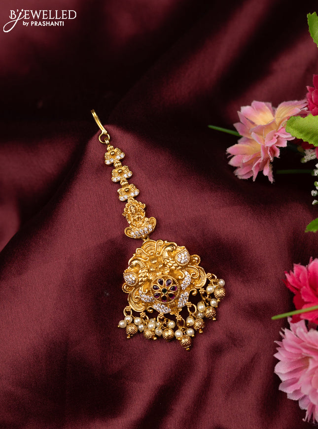 Antique maang tikka lakshmi & peacock design with kemp and cz stones and pearl hangings