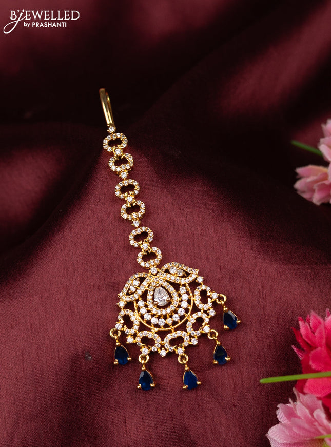 Zircon maang tikka with sapphire & cz stones in gold finish
