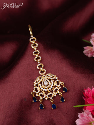 Zircon maang tikka with sapphire & cz stones in gold finish