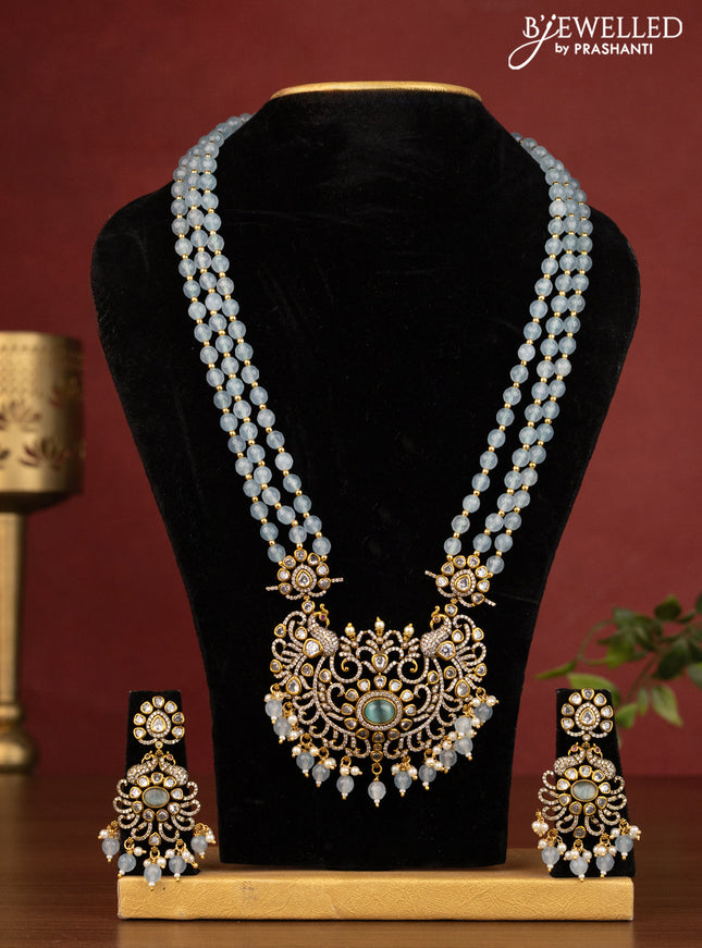 Beaded ice blue triple layer necklace peacock design with cz stones and beads hanging