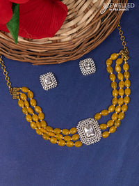 Beaded yellow triple layer choker with cz stones