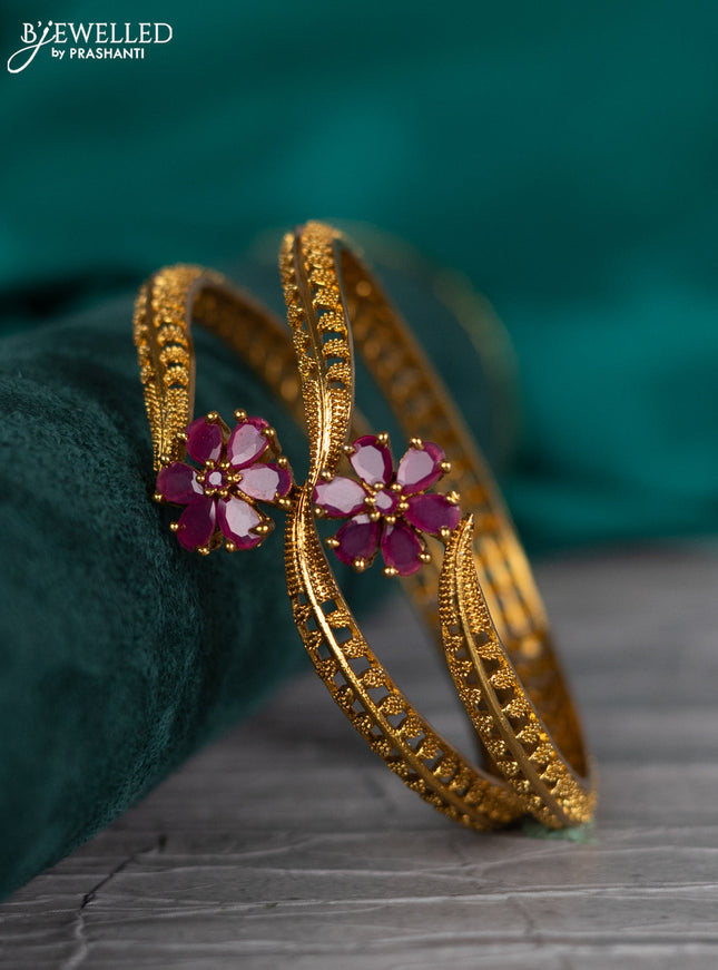 Antique bangle with floral design and pink kemp stones