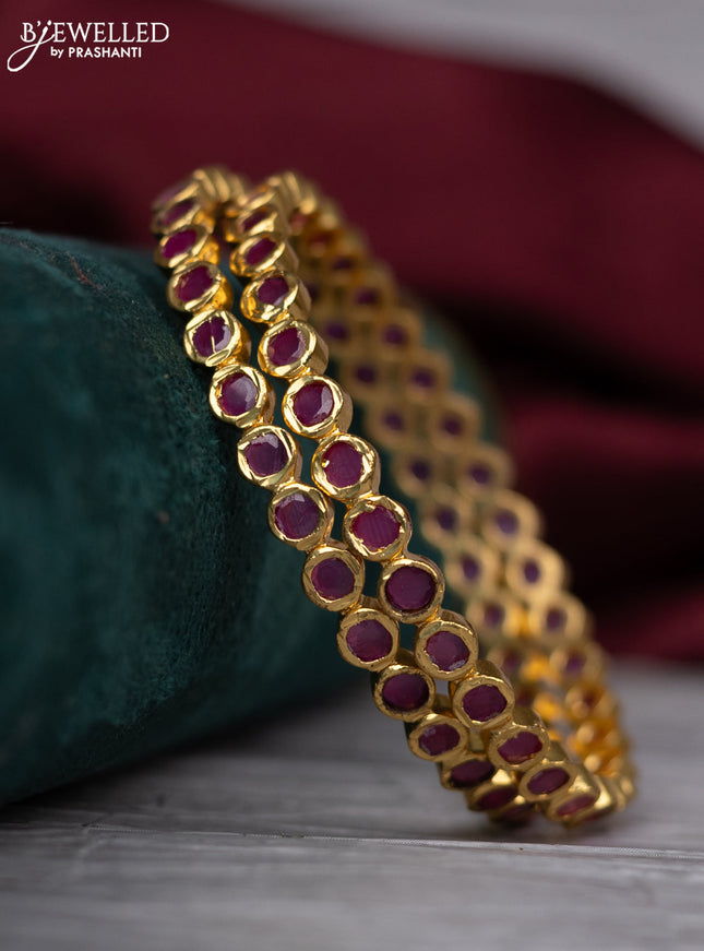 Zircon bangle with ruby and cz stones in gold finish