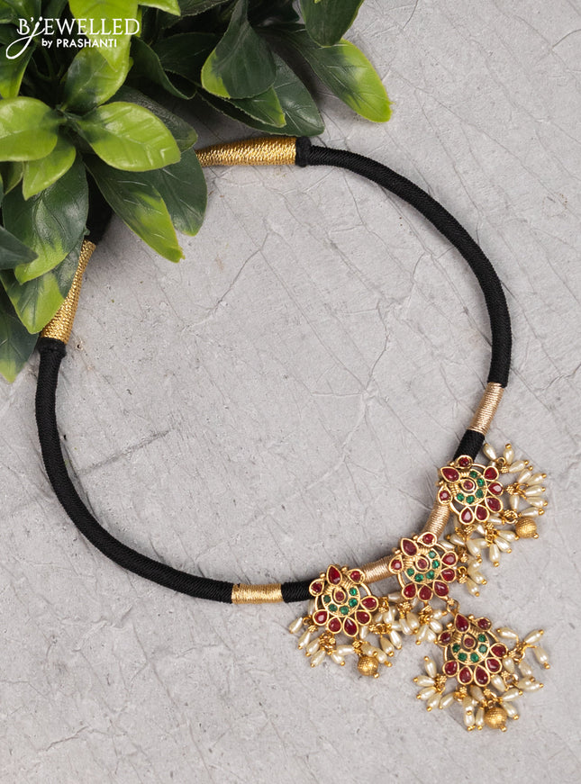 Black thread necklace with kemp stones and pearl hangings without earrings