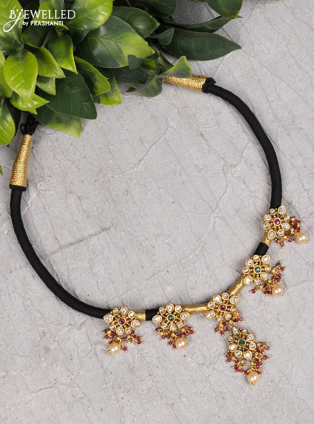 Black thread necklace with kemp & cz stones and crystal beads hanging without earrings