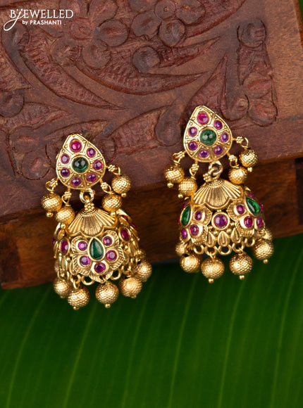 Antique jhumka with kemp stones and golden beads hanging