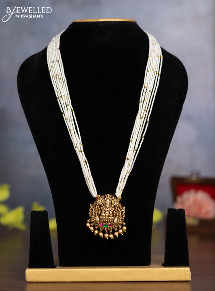 Pearl haaram lakshmi pendant with kemp stones and golden beads hanging without earrings