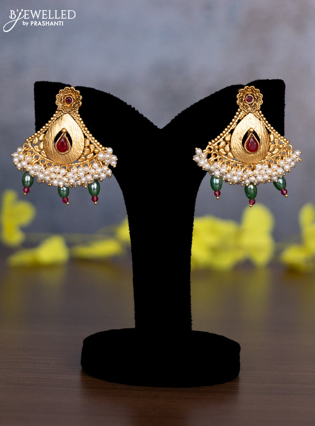 Pearl necklace floral design with kemp & cz stones and pearl & green beads hanging