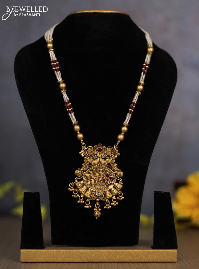 Pearl necklace peacock & floral design with ruby & kundan stones and golden beads hanging without earrings