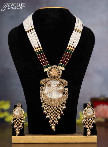 Pearl necklace floral design with kemp & cz stones and pearl & golden beads hanging