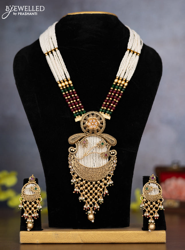Pearl necklace floral design with kemp & cz stones and pearl & golden beads hanging