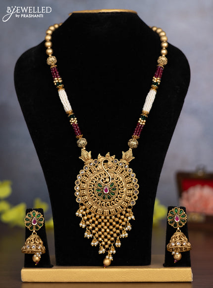 Pearl necklace with kemp & white stones and pearl & golden beads hanging