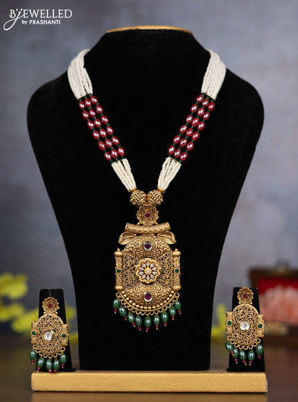 Pearl necklace with kemp & cz stones and green beads hanging