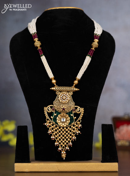 Pearl necklace floral design with ruby & cz stones and pearl & golden beads hanging without earrings