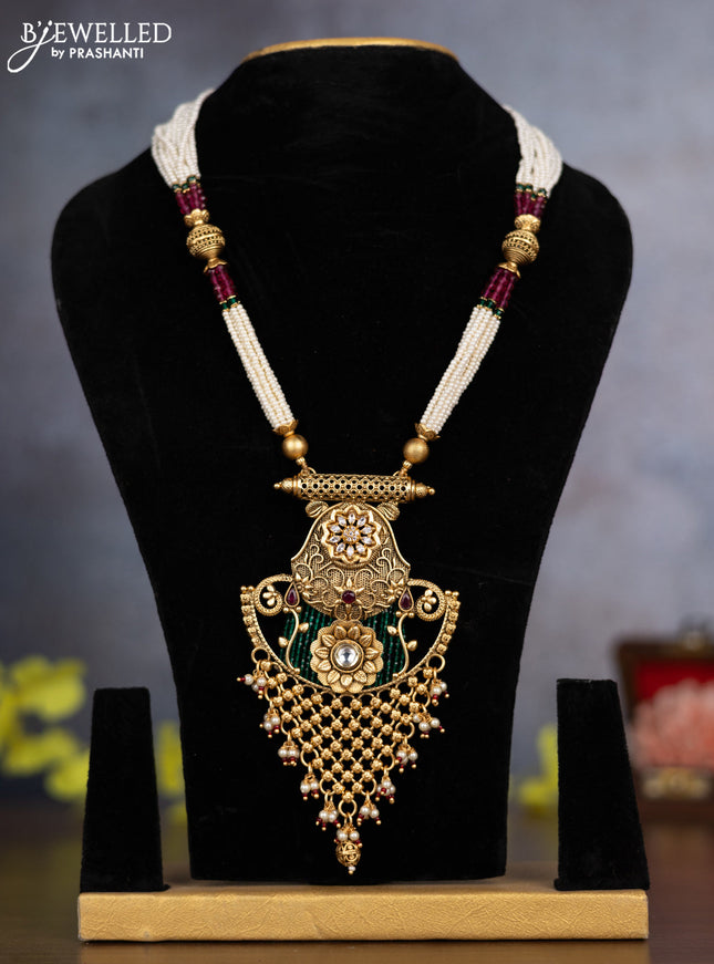 Pearl necklace floral design with ruby & cz stones and pearl & golden beads hanging without earrings