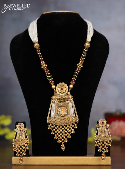 Pearl necklace with kemp & cz stones and golden beads hanging