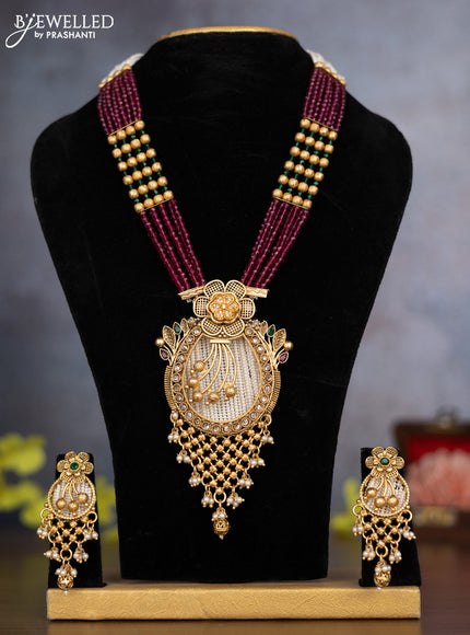 Pearl necklace floral design with kemp & cz stones and pearl & golden beads hanging