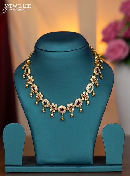 Antique necklace with kemp & cz stones and golden beads hanging without earring