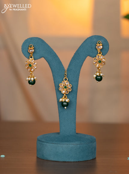 Antique necklace with emerald & cz stones and green beads hanging with maang tikka