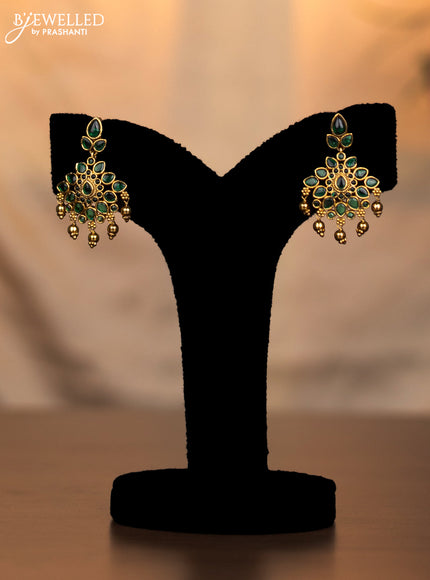 Antique necklace floral design with emerald stones and golden beads hanging