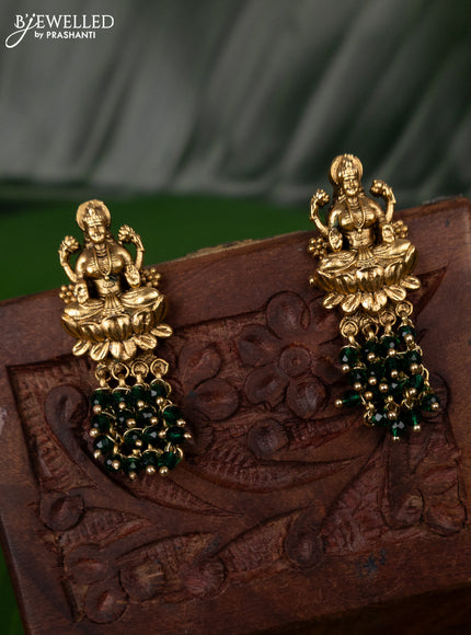 Antique earring with lakshmi design and green beads hanging
