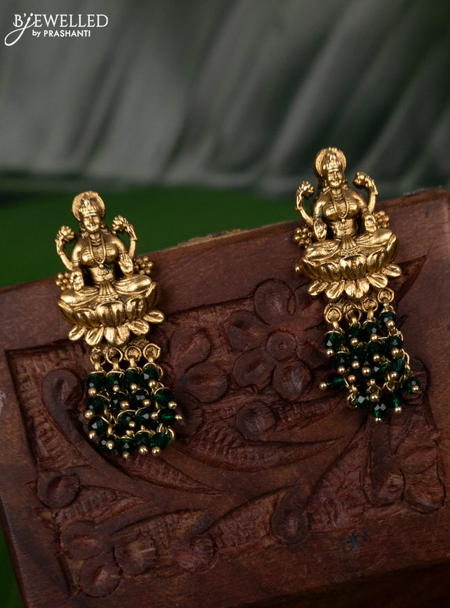 Antique earring with lakshmi design and green beads hanging