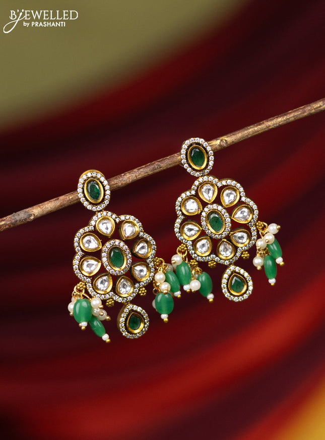 Earring with emerald & cz stones and pearl & green beads hanging in victorian finish