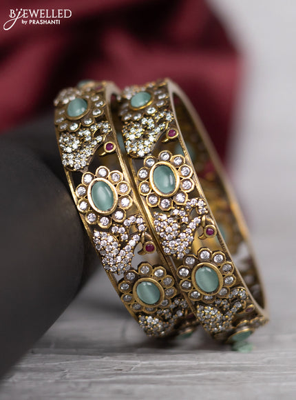 Victorian finish bangle swan design with mint green and cz stones