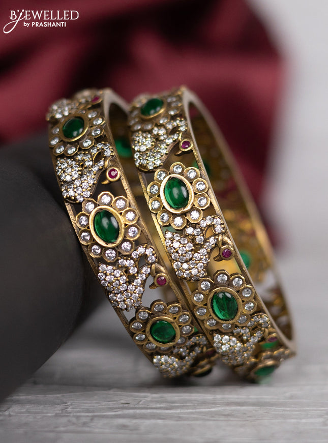 Victorian finish bangle swan design with emerald and cz stones