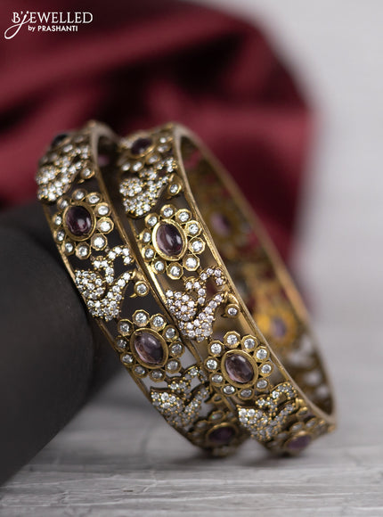 Victorian finish bangle swan design with violet and cz stones