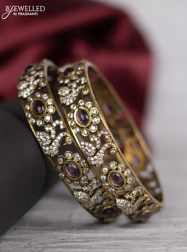 Victorian finish bangle swan design with violet and cz stones