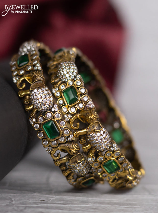 Victorian finish bangle elephant design with emerald and cz stones