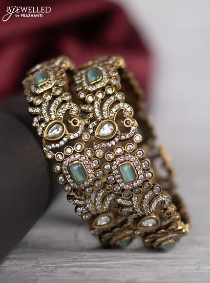 Victorian finish bangle peacock design with mint green & kundan and cz stones