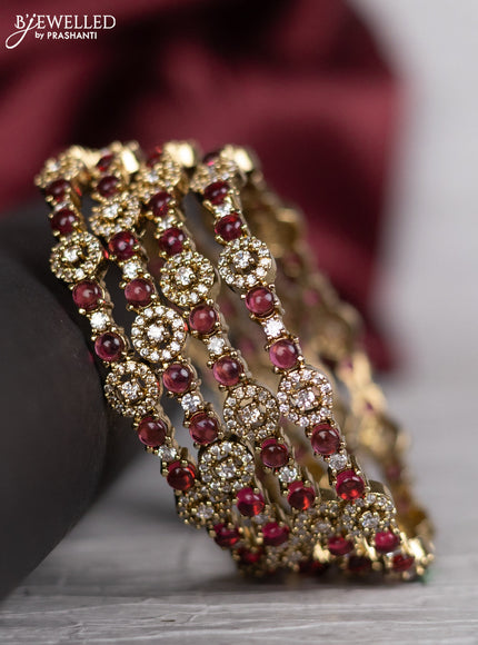 Victorian finish bangle with ruby and cz stones