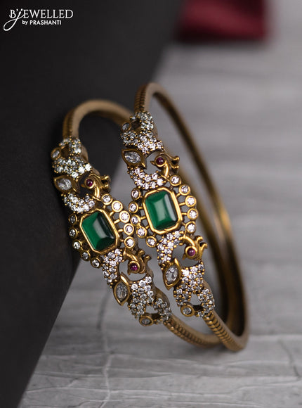 Victorian finish bangle peacock design with emerald and cz stones