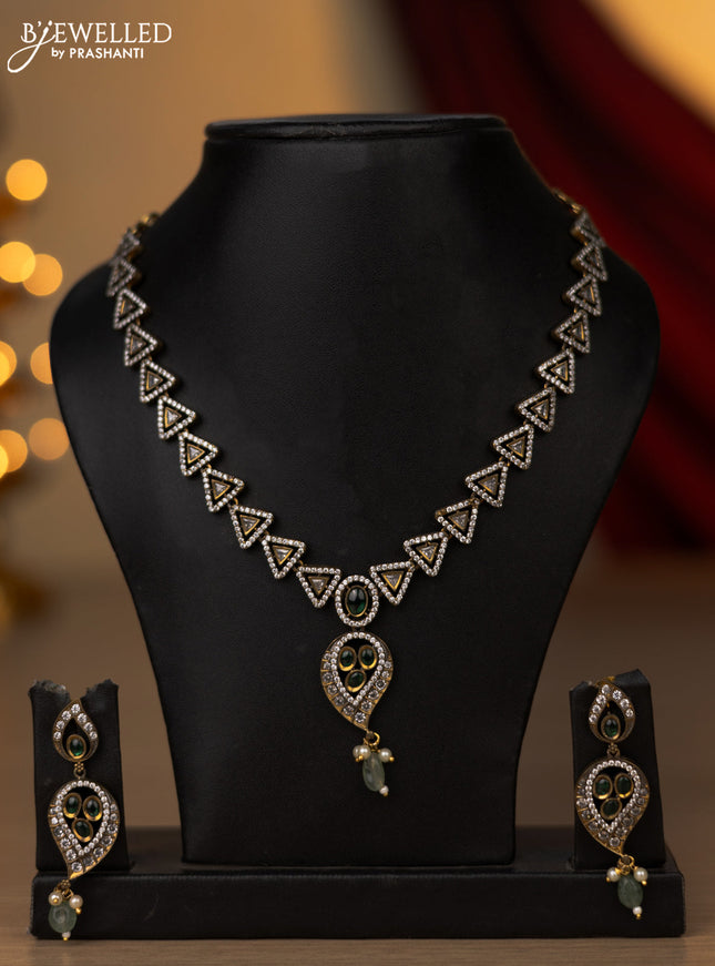 Necklace with leaf design green and cz stones