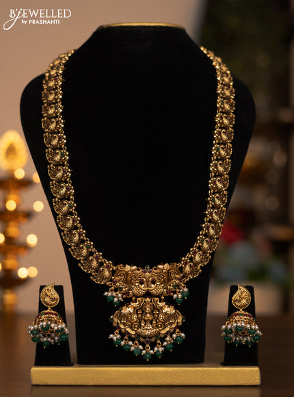 Antique haaram lakshmi design with kemp stones and pearl & green beads hanging