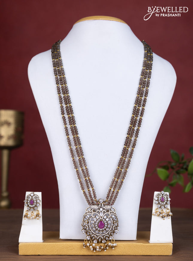 Beaded triple layer brown necklace with ruby & cz stones and pearl hangings in victorian finish